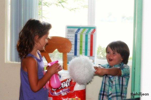 Kids armed with cleaning supplies